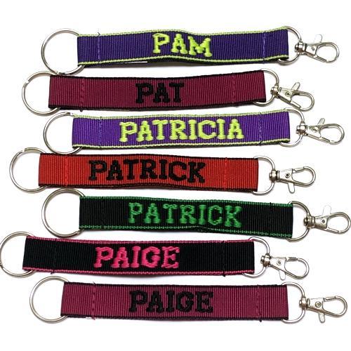 Wholesale Bundle of 100 - Embroidered Novelty Keychains - Nylon Key Strap & Clip (1" x 7.75") Assorted Names & Phrases